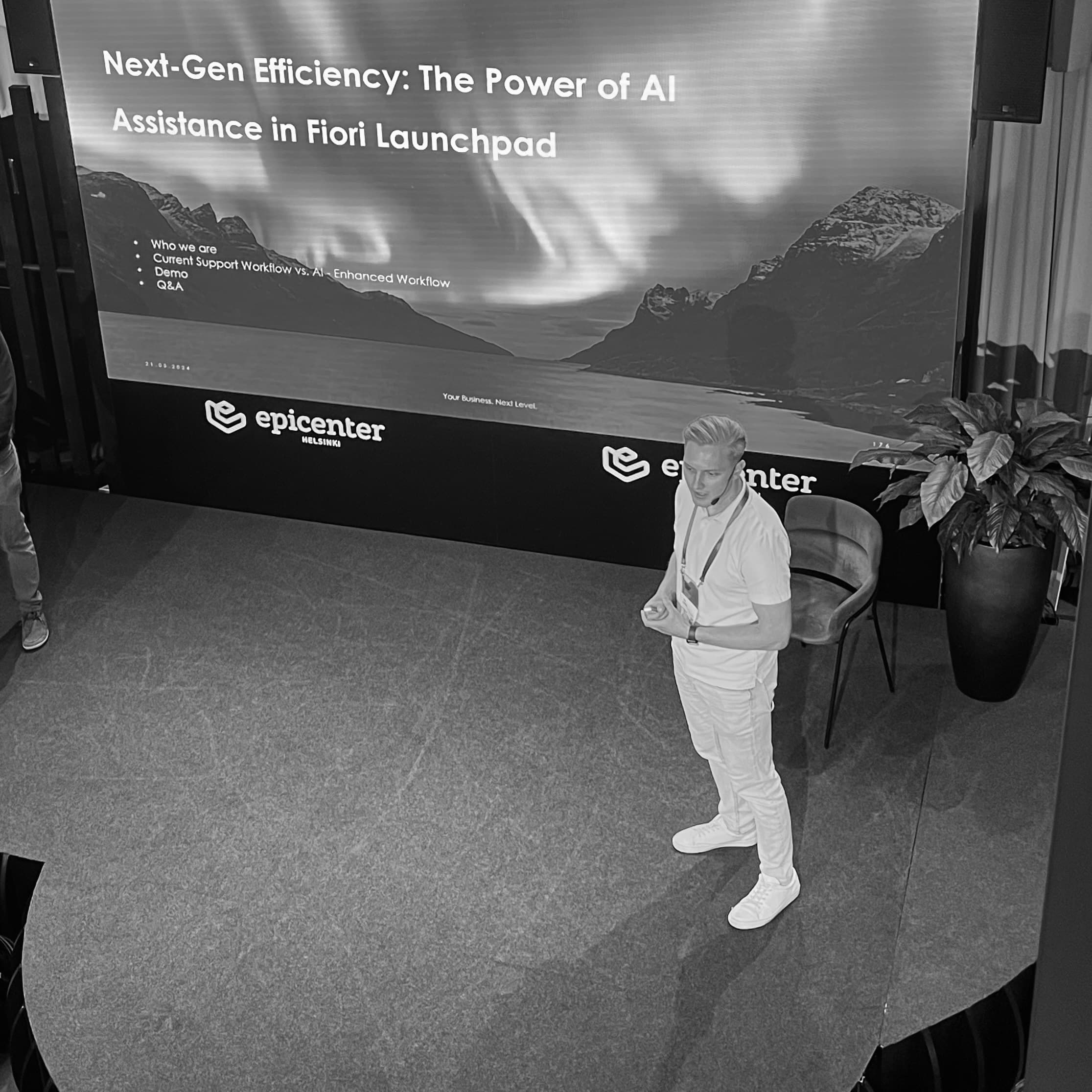 Jere Kelonen speaking on stage